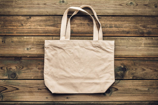 Zero waste, Recycling, Sustainable lifestyle concept. Eco-friendly cotton bag on wooden background stock photo