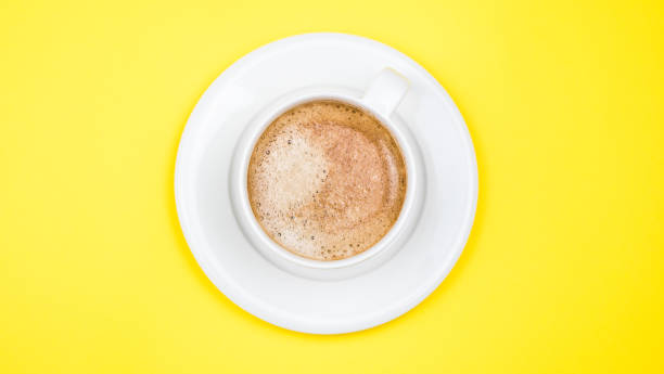 istock A cup of black coffee on blue background. View from above. copy space 1203196205