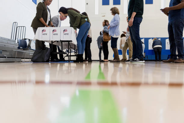 istock Low angle view people signing up to vote 1203196303