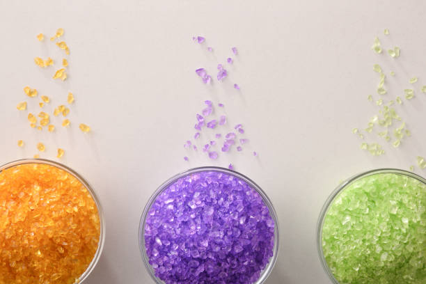 istock Bath salts in containers on white table close up top 1203204482