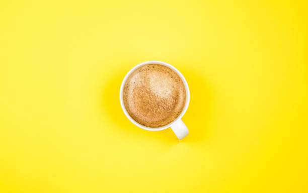 istock Top view image of coffe cup on yellow background. Flat lay. Copy space 1203204892