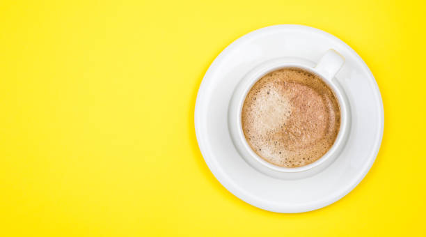 istock Top view image of coffe cup on yellow background. Flat lay. Copy space 1203205209