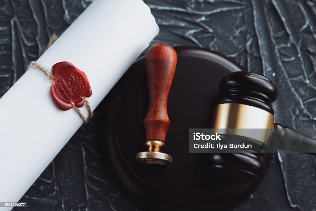 Notary's public pen and stamp on testament and last will. Notary public Notary's public pen and stamp on testament and last will. Notary public tools Notary Stock Photo