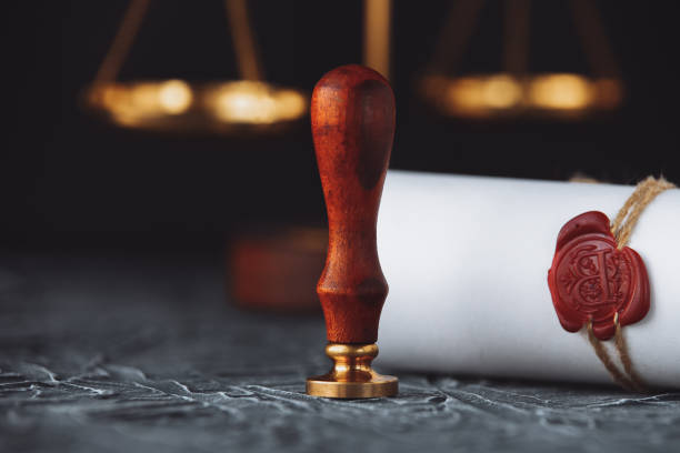 istock Notary public wax seal on old document. Law office 1203206586