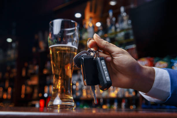 istock Do not drink and drive Cropped image of drunk man talking car 1203208486