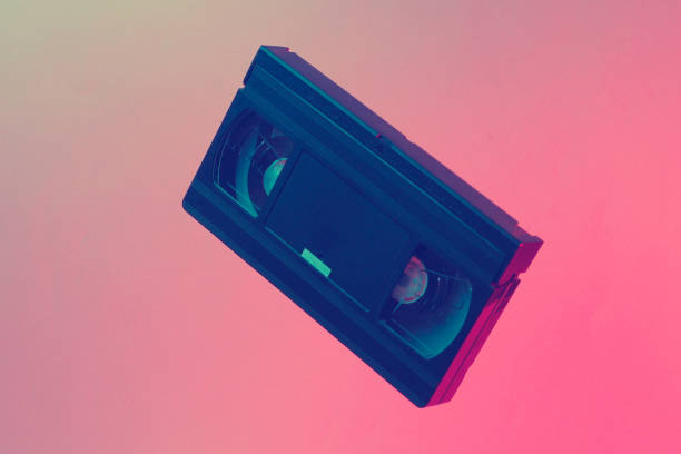 istock Minimalism retro style concept. 80s. Video cassette in neon red blue light. Retro wave 1203209394