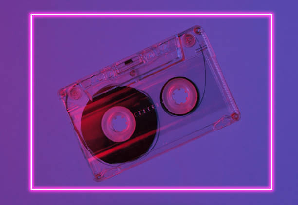 istock Minimalism retro style concept. 80s. Audio cassette in neon red blue light. Retro wave 1203209436