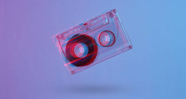 istock Minimalism retro style concept. 80s. Audio cassette in neon red blue light. Glitch effect 1203209469