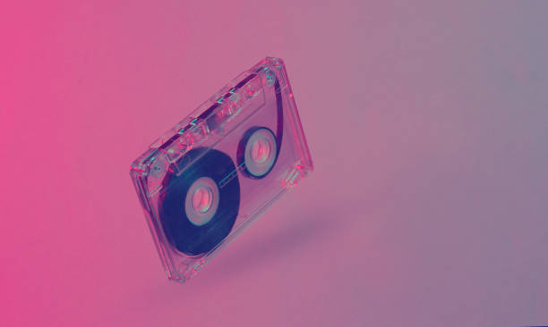 istock Minimalism retro style concept. 80s. Audio cassette in neon red blue light. Retro wave 1203209527