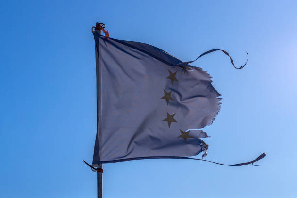 istock Ruptured European Union flag. EU breakup concept. 1203210309