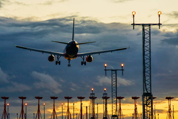 istock Passenger Jet landing with landing lights in the foreground 1203210436