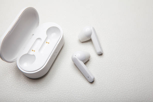 istock earphones case white leather background 1203211460