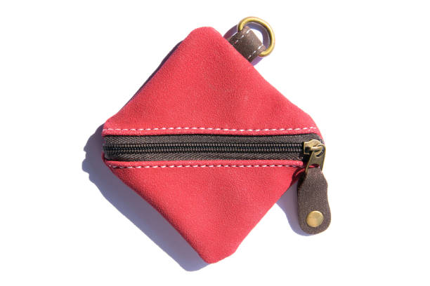 istock Small leather purse with zipper isolated on white background. Red square wallet leather bag with zipper lock and key chain 1203213051