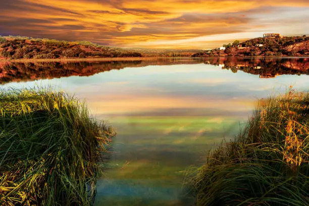 Photo of Reflections in the lagoons of Ruidera at sunset