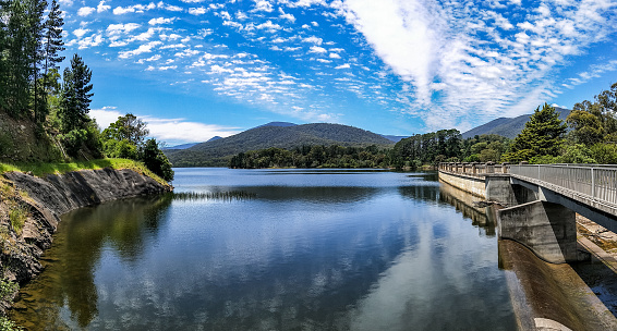 A wide-angle view on Maroondah Reservoir and Dam in Healesville, Victoria, Australia, in a sunny spring day.