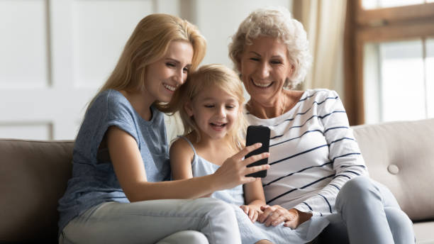 istock Happy 3 generations family having fun at home. 1203220202