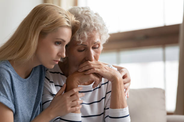 istock Empathic daughter embracing desperate middle aged mother. 1203220273