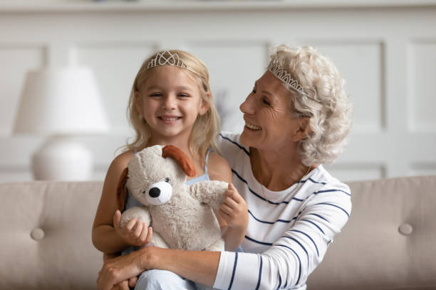 istock Smiling elderly mature woman communicating with kid at home. 1203220289