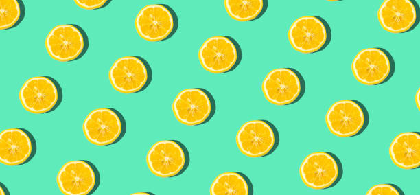 istock Summer and vitamins background. Lemon on a blue background, minimal food concept 1203224398