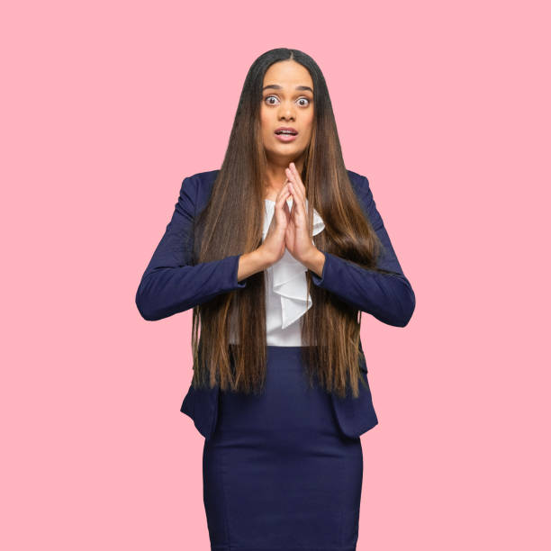 African-american ethnicity female manager standing in front of colored background wearing jacket Portrait of aged 30-39 years old who is beautiful african-american ethnicity female manager standing in front of colored background wearing jacket who is phobia embarrassment skirt photos stock pictures, royalty-free photos & images