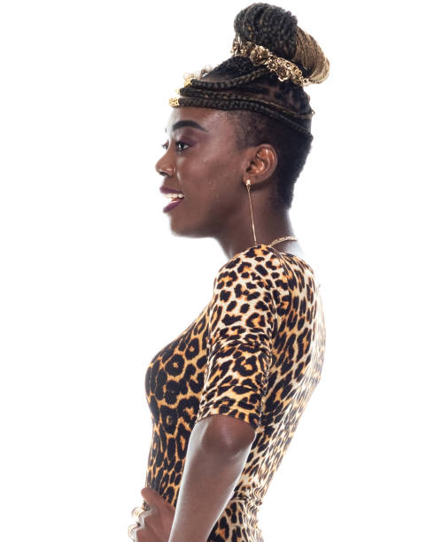 Side view / profile view / one person / waist up / portrait of 20-29 years old adult beautiful cornrow braids / black hair african ethnicity / african-american ethnicity young women / female standing wearing dress who is smiling / happy / cheerful / laughing / cool attitude with hand on hip vista lateral / vista de perfil / una persona / cintura para arriba / retrato de 20-29 años de edad adulto hermosas trenzas de cornrow / pelo negro etnia africana / etnia afroamericana mujeres jóvenes / mujer de pie usando vestido / actitud fresca con la
