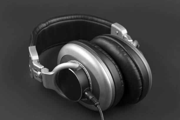 istock Professional headphones with wire on a dark background. 1203226421