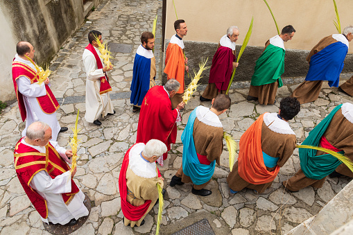 Italy, Sicily, Messina Province, Montalbano Elicona. April 14, 2019. Parishioners parade to the parish church for Palm Sunday services in Montalbano Elicona.
