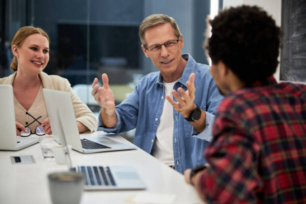 istock Business colleagues discussing business project in office 1203227468