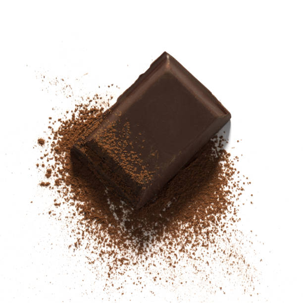 istock Dark chocolate piece on cocoa powder isolated on white background 1203229193