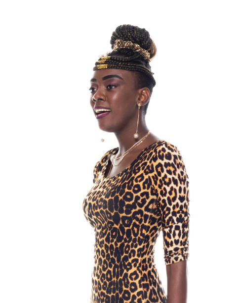 Side view / profile view / one person / waist up / portrait of 20-29 years old adult beautiful cornrow braids / black hair african ethnicity / african-american ethnicity young women / female standing wearing dress who is smiling / happy / cheerful / laughing / cool attitude with hand by side vista lateral / vista de perfil / una persona / cintura para arriba / retrato de 20-29 años de edad adulto hermosas trenzas de cornrow / pelo negro etnia africana / etnia afroamericana mujeres jóvenes / mujer de pie usando vestido / actitud fresca con ma