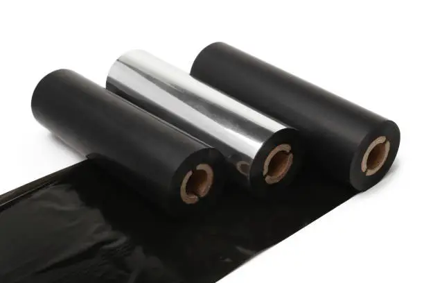 Photo of Black roll wax ribbon for thermal transfer printer in core
