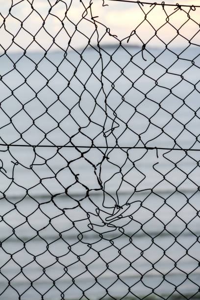 chain link fence stock photo