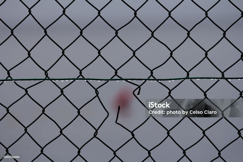 wire fence wire fence with a hole Abstract Stock Photo