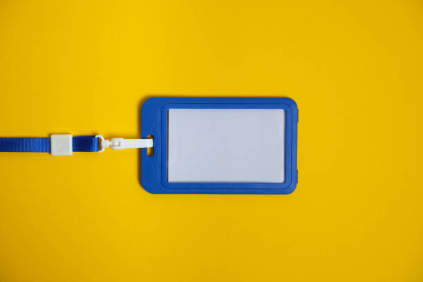 istock Security Badge on yellow background, invitation letter concept, job finding 1203232241
