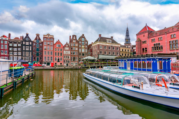 istock Amsterdam architecture along Damrak canal, Netherlands 1203232504