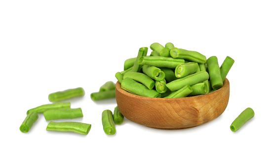 Bowl of green beans isolated on white background
