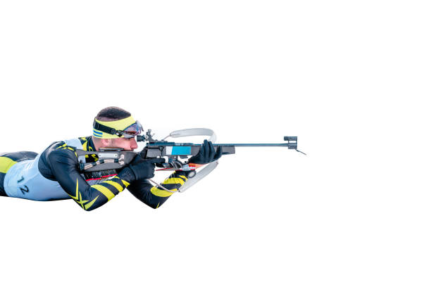 istock Isolated biathlon skier with rifle in shooting prone position 1203232605