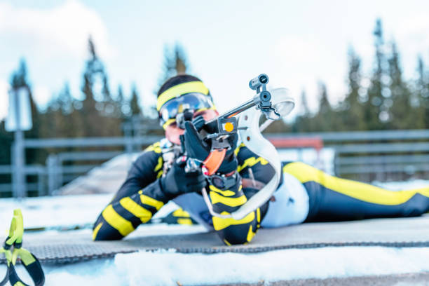 detail of the rifle barrel biathlon shooter while aiming. the concept of precision and concentration under pressure - biathlon imagens e fotografias de stock