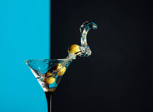 istock Martini with green olives splash. 1203233599