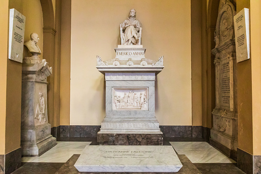 Italy, Sicily, Province of Palermo, Palermo. April 21, 2019. Memorials to Emerico and Giovanni Falcone inside the Cathedral of Palermo, a UNESCO World Heritage Site, constructed in 1184.