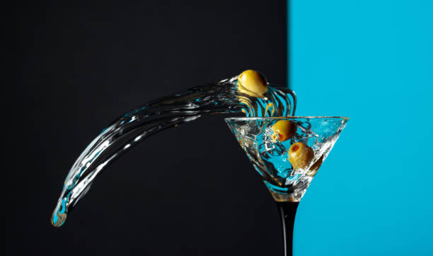 istock Martini with green olives splash. 1203233769