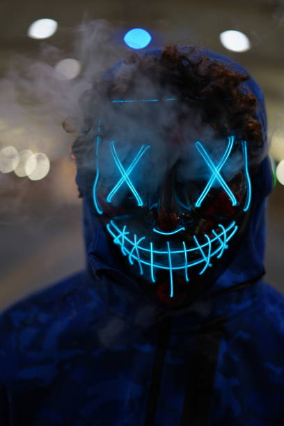 istock Male halloween hacker mask glowing 1203234309