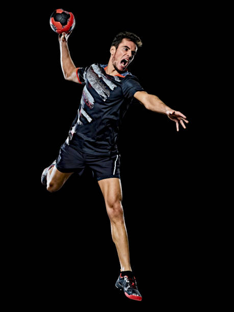 caucasian young handball player man isolated black background one caucasian young handball player man in studio isolated on black background handball stock pictures, royalty-free photos & images