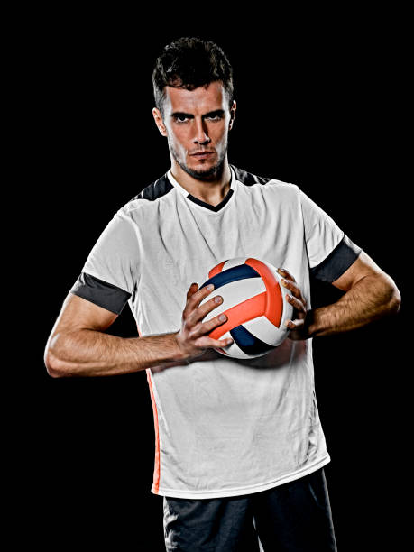 istock caucasian young volley ball player manisolated black background 1203235970
