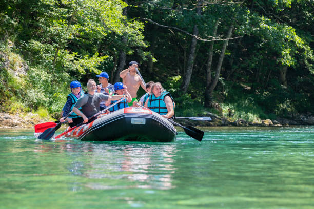 istock Rafting team goes down the river on the beautiful sunny day. 1203240957