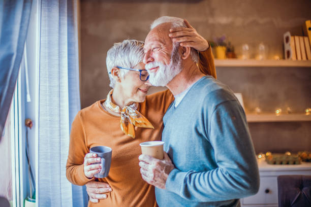 istock Beautiful senior couple drinking coffee. 1203241017