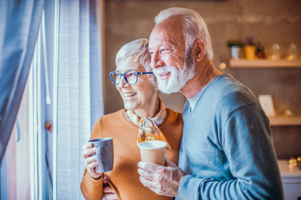 istock Beautiful senior couple drinking coffee. 1203241033