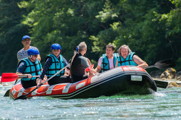 istock Rafting team goes down the river on the beautiful sunny day. 1203241132
