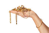 Hand Holding Gold Jewelry