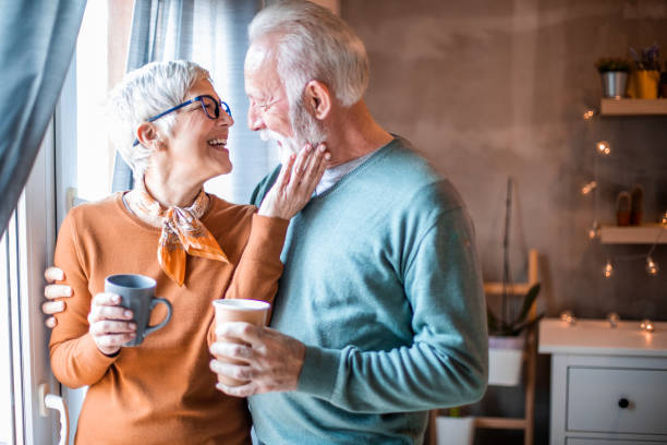 istock Beautiful senior couple drinking coffee. 1203245695